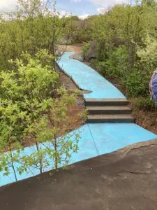 A concrete path painted blue